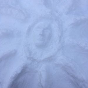 radial formation with face in snow